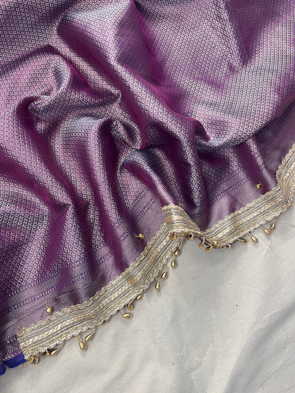 Lavender Shade Tissue Silk Saree With Ghungroo & Designer Border Lace Saree